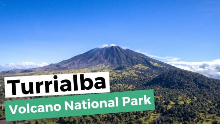 Aerial view of Turrialba Volcano surrounded by green slopes under a clear blue sky at Turrialba Volcano National Park, Costa Rica
