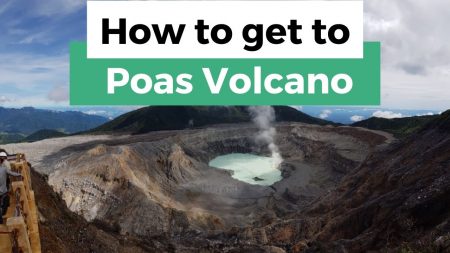 Scenic view of Poás Volcano crater with steam rising from its turquoise lake in Costa Rica.