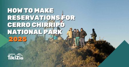 Group of hikers at Cerro Chirripó summit with Costa Rica flag, promoting 2025 reservation guide by Explore Tikizia.